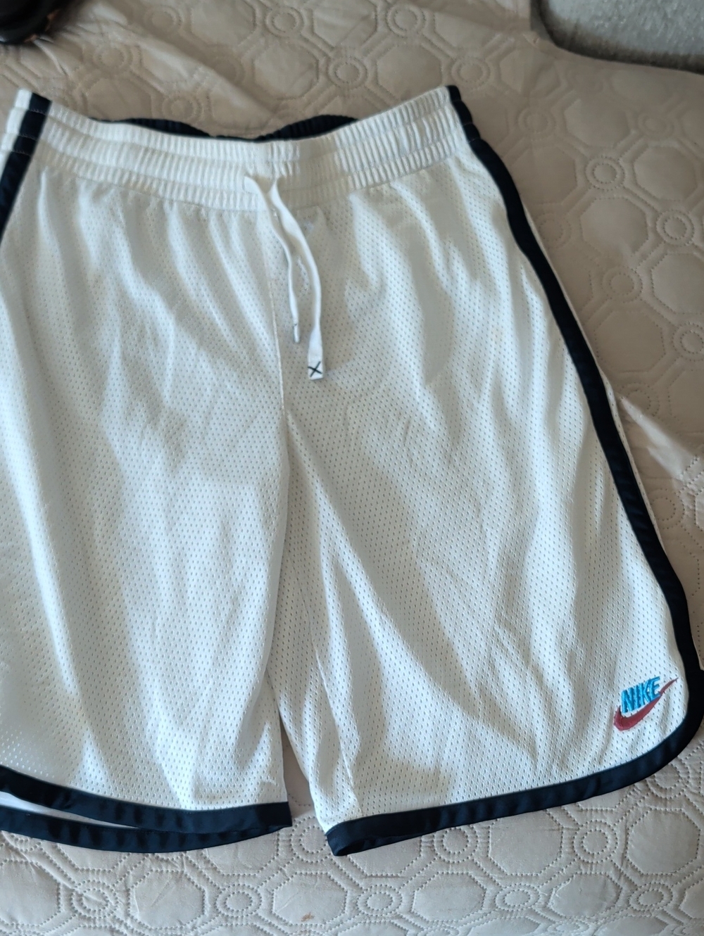 Nike Men’s White Mesh Athletic Shorts with Black Trim and Blue Logo